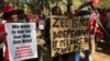 Members of the Movement for Democratic Change Alliance (MDC) protest against the Zimbabwe Electoral Commission, which they accuse of plotting to rig for ruling ZANU-PF party, in Harare, July 11, 2018.