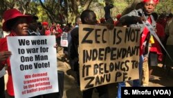 Members of the Movement for Democratic Change Alliance (MDC) protest against the Zimbabwe Electoral Commission, which they accuse of plotting to rig for ruling ZANU-PF party, in Harare, July 11, 2018.