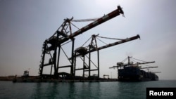 FILE - A view of the container terminal at the southern Yemeni port of Aden. On Thursday, July 26, Saudi Energy Minister Khaled Faleh was quoted by a Saudi TV station as saying the state-owned Saudi oil giant Aramco was temporarily stopping oil shipments through the strategic Bab al-Mandab Strait.