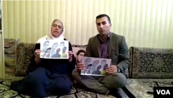 Ameneh Ghaderi, mother of detained Iranian Kurdish activist Zaniar Moradi, and Amjad Hossein Panahi, brother of detained Iranian Kurdish activist, Ramin Hossein Panahi, make a statement from Marivan, Iran, on September 7, 2018.
