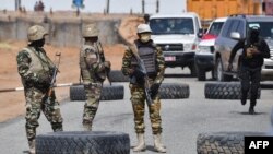 FILE: Nigerien soldiers stand guard outside the Diffa airport in South-East Niger, near the Nigerian border, on December 23, 2020. - Under the constant threat of Boko Haram and its dissidents, Diffa, the large city in southeastern Niger on the Nigeria border, lives under siege.