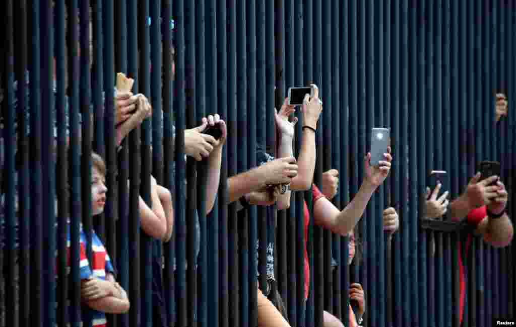 Fans watch the Tour de France 116-km Stage 21 from Houilles to Paris Champs-Elysees, July 29, 2018.