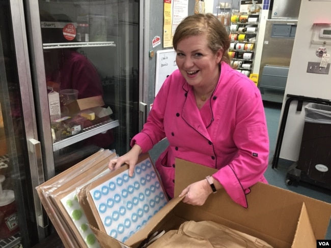 Sarah Dwyer says making chocolate-covered caramels the old fashioned way has given her a dream career while spreading joy to people. (VOA Photo/J.Taboh)