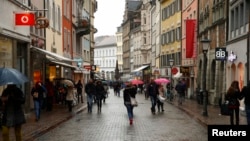 FILE - People walk along a street in the southern German town of Konstanz, Jan. 17, 2015. A shooting at a nightclub in the city left one person dead, three more injured. Police later fatally wounded the suspected gunman.