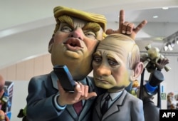 A Ninot, a doll depicting a celebrity that will be set alight during the Fallas festival, representing U.S. President Donald Trump and Russian President Vladimir Putin is displayed in Valencia on March 09, 2018.