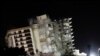 Bagian dari apartemen Champlain Towers South yang roboh diledakkan, di Surfside, Florida, Minggu, 4 Juli 2021. (Foto: Marco Bello/Reuters)