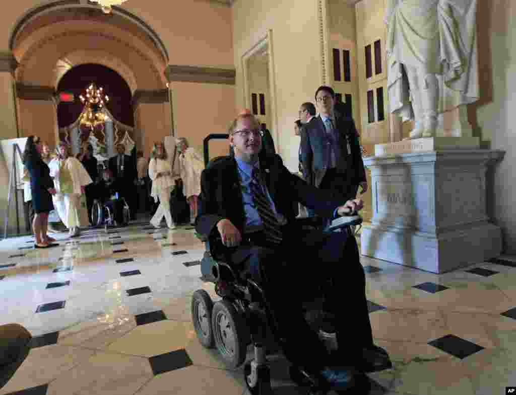 Rep. Jim Langevin, D-R.I., heads to the House floor on Capitol Hill in Washington Monday, July 26, 2010 to preside over the House after an event celebrating the Americans with Disabilities Act.