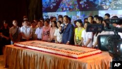 Foxconn Chairman Terry Gou (C) prepares to cut a giant cake at an event to celebrate Taiwan-based contract manufacturing giant Foxconn's 30th anniversary of its first investment in Shenzhen, south China's Guangdong province, June 6, 2018.