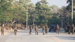 Soldiers stand guard at a Myanmar's military checkpoint on the way to the congress compound in Naypyitaw, Myanmar, February 1, 2021.