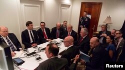 U.S. President Donald Trump is shown in an official White House handout image meeting with his National Security team after a missile strike on Syria in West Palm Beach, Florida, April 6, 2017.