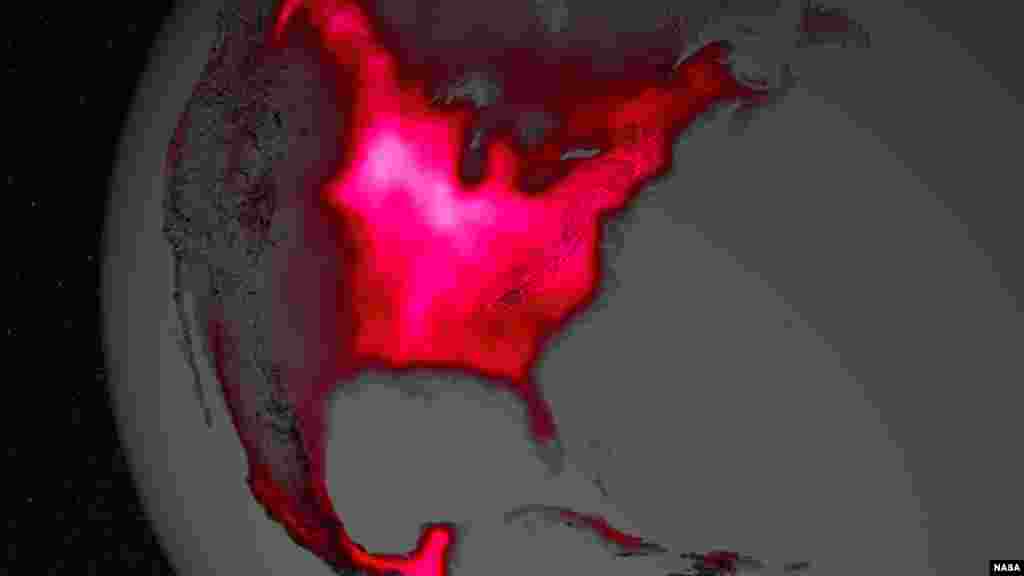The magnitude of fluorescence portrayed in this visualization prompted researchers to take a closer look at the productivity of the U.S. Corn Belt. The glow represents fluorescence measured from land plants in early July, over a period from 2007 to 2011. (Image Credit: NASA's Goddard Space Flight Center)