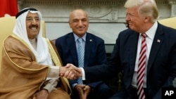 President Donald Trump shakes hands with Amir of Kuwait Sheikh Sabah Al Ahmad Al Saba during a meeting in the Oval Office of the White House, Sept. 7, 2017, in Washington.