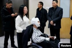 Worker Hu is seen bandaged at a hospital after he was injured following an explosion at a pesticide plant owned by Tianjiayi Chemical in Yancheng, Jiangsu province, China, March 24, 2019.