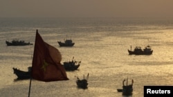 Fishing boats are seen on bay of Ly Son islands of Vietnam's central Quang Ngai province, April 10, 2012. 