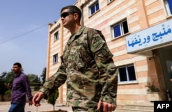 U.S. Army Maj. Gen. Jamie Jarrard leaves after a meeting in the YPG-held northern Syrian city of Manbij, where the U.S. has a military presence, March 22, 2018.