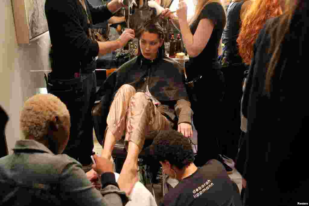 Model Bella Hadid is prepared backstage before walking in the Brandon Maxwell Spring/Summer 2018 collection presentation at New York Fashion Week in Manhattan.