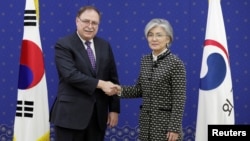 South Korean Foreign Minister Kang Kyung-wha and Timothy Betts, acting Deputy Assistant Secretary and Senior Adviser for Security Negotiations and Agreements in the U.S. Department of State, shake hands before their meeting at Foreign Ministry in Seoul, S