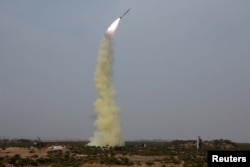 FILE - A new type of anti-air guided weapon system is fired in this undated photo released by North Korea's Korean Central News Agency (KCNA), April 2, 2016.