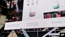 Google vice president Mario Queiroz talks about the uses of the new Google Home device during the keynote address of the Google I/O conference, Wednesday, May 18, 2016, in Mountain View, Calif. (AP Photo/Eric Risberg)