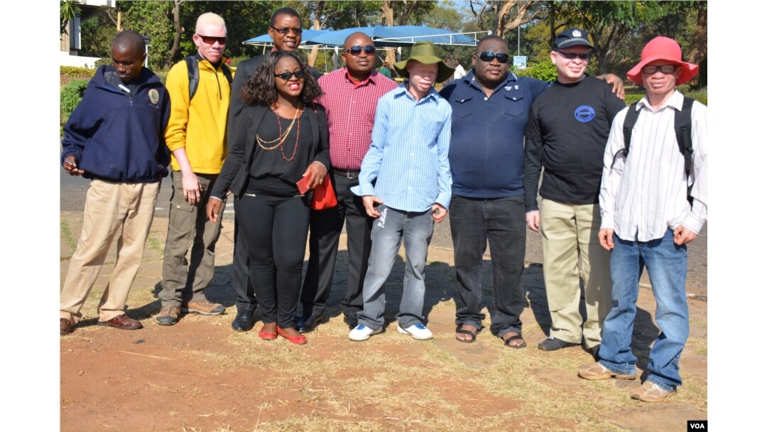People with albinism pose with campaigners for their rights in the capital of Lilongwe, Malawi, in early 2016 before the start of street protests against recent attacks. Albinos are targeted because of the false belief that their body parts have powers to increase wealth.