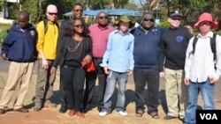 FILE - People with albinism pose with campaigners for their rights in the capital of Lilongwe, Malawi, in early 2016 before the start of street protests against attacks. 