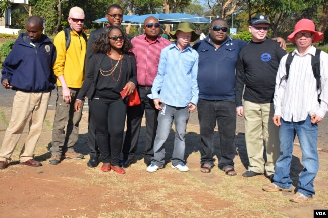People with albinism pose with campaigners for their rights in the capital of Lilongwe, Malawi, in early 2016 before the start of street protests against recent attacks. Albinos are targeted because of the false belief that their body parts have powers to increase wealth.