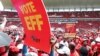 Supporters of South Africa's radical left-wing party, the Economic Freedom Fighters, hold a placard during the launch of the party's election manifesto in Soshanguve, near Pretoria, South Africa, Feb. 2, 2019.