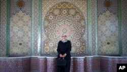 FILE - Aziza Moufid, 40, a female Muslim religious guide, or mourchida, poses for a portrait in Lalla Soukaina mosque, in Hay Riad neighborhood of Rabat, Morocco, Nov. 9, 2021.