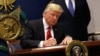 US President Donald Trump signs an executive order