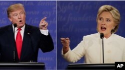 Republican presidential nominee Donald Trump and Democratic presidential nominee Hillary Clinton speak during the third presidential debate at UNLV in Las Vegas, Oct. 19, 2016. 