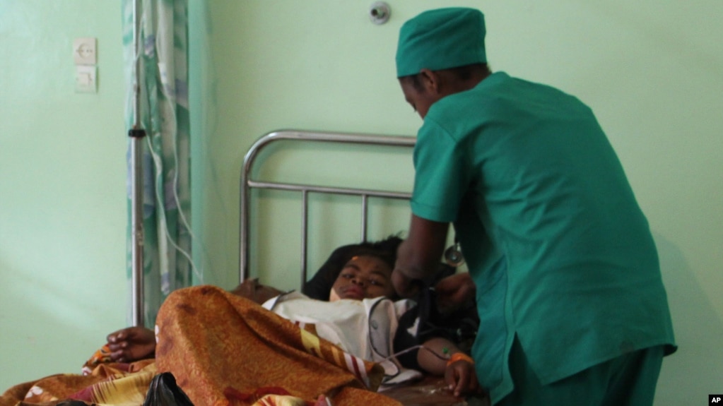 FILE - A person is treated, at a public hospital in Antananarivo, Madagascar.
