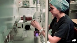An embryologist at work at a fertility clinic in London. 