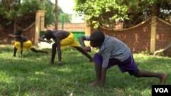 Young orphans practice capoeira on the grounds of their orphanage. The martial art was developed centuries ago by African slaves in Brazil, April 20, 2017. (Z. Baddorf/VOA)