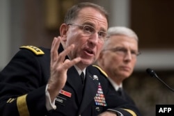 FILE - U.S. Army General Robert Abrams, left, testifies during his nomination hearing to be commander of all U.S. forces in Korea, in Washington, Sept. 25, 2018.