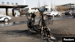 A burnt electric bicycle is pictured following a blast near a chemical plant in Zhangjiakou, Hebei province, China, Nov. 28, 2018.