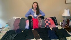 This photo shows Cameron Howe at home in Lynchburg, Va., on June 28, 2021, with her collection of leggings she bought during the pandemic. She hopes to continue wearing leggings as business clothing as she goes back to work. (Cameron Howe via AP)