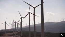 Wind farms like this array of turbines near Tangiers, Morocco, present a renewable energy alternative to traditional sources of electricity in Africa. 