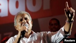 FILE - Salvador Sanchez Ceren, the presidential candidate for the Farabundo Marti National Liberation Front (FMLN), gives a speech to his supporters, after the official election results were released, in San Salvador, March 9, 2014. 