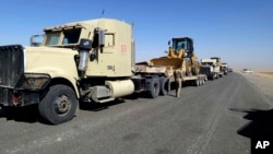 Iraqi security forces are stationed outside the city of Shirqat near Mosul, Iraq, Sept. 20, 2016. Iraqi forces have launched a new military operation to recapture a key town north of Baghdad from the Islamic State group. 