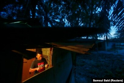 Potret sebuah rumah pekerja perkebunan kelapa sawit distrik Klang, di luar Kuala Lumpur, 16 April 2014. (Foto: REUTERS/Samsul Said)