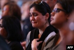 People attend an Interfaith Prayer Vigil at Olivet Baptist Church to honor the four Marines shot to death in Chattanooga, Tennessee, July 17, 2015.