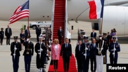 French President Emmanuel Macron and his wife Brigitte Macron arrive for their state visit to Washington and meetings with U.S. President Donald Trump after landing at Joint Base Andrews in Maryland, April 23, 2018. 