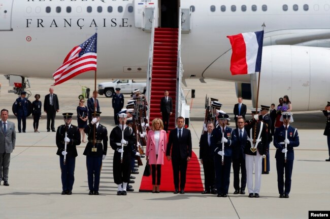 French President Emmanuel Macron and his wife Brigitte Macron arrive for their state visit to Washington and meetings with U.S. President Donald Trump after landing at Joint Base Andrews in Maryland, April 23, 2018.