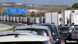 Vehicles on the AP-7 highway are stuck in traffic due to a protest organized by pro-independence supporters, near Figueres, Spain, March 27, 2018. 