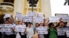 FILE - Vietnamese protesters hold banners reading "Get out Formosa" and "I love the sea, shrimp and fish" during a rally denouncing recent mass fish deaths in Vietnam's central province, in Hanoi, Vietnam, May 1, 2016.