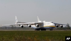 The world's largest airplane, Ukrainian Antonov An-225 Mriya takes off at the airport near Hostomel near Kyiv, Ukraine, May 10, 2016.