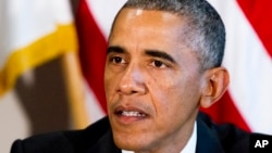 President Barack Obama attends a meeting with senior military leadership including Secretary of Defense Chuck Hagel, and Chairman of the Joint Chiefs of Staff Gen. Martin Dempsey at the Pentagon on Oct. 8, 2014.