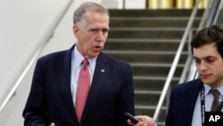 FILE - Sen. Thom Tillis, R-N.C., talks with reporters on Capitol Hill, May 17, 2018.