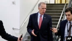 Sen. Thom Tillis, R-N.C., talks with reporters as he departs after a vote to confiirm Gina Haspel as CIA director, on Capitol Hill, May 17, 2018 in Washington.