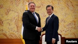 U.S. Secretary of State Mike Pompeo shakes hands with South Korea's President Moon Jae-in during a bilateral meeting at the presidential Blue House in Seoul, South Korea, June 14, 2018.